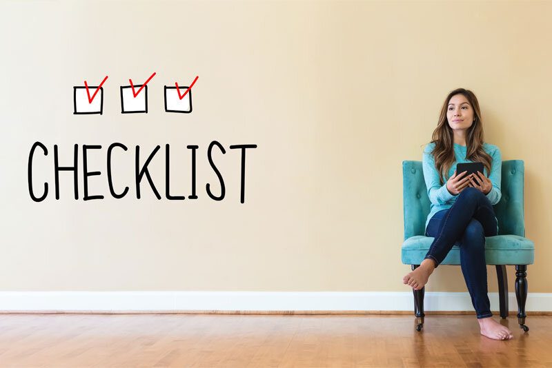 Checklist on Wall With Woman in Chair
